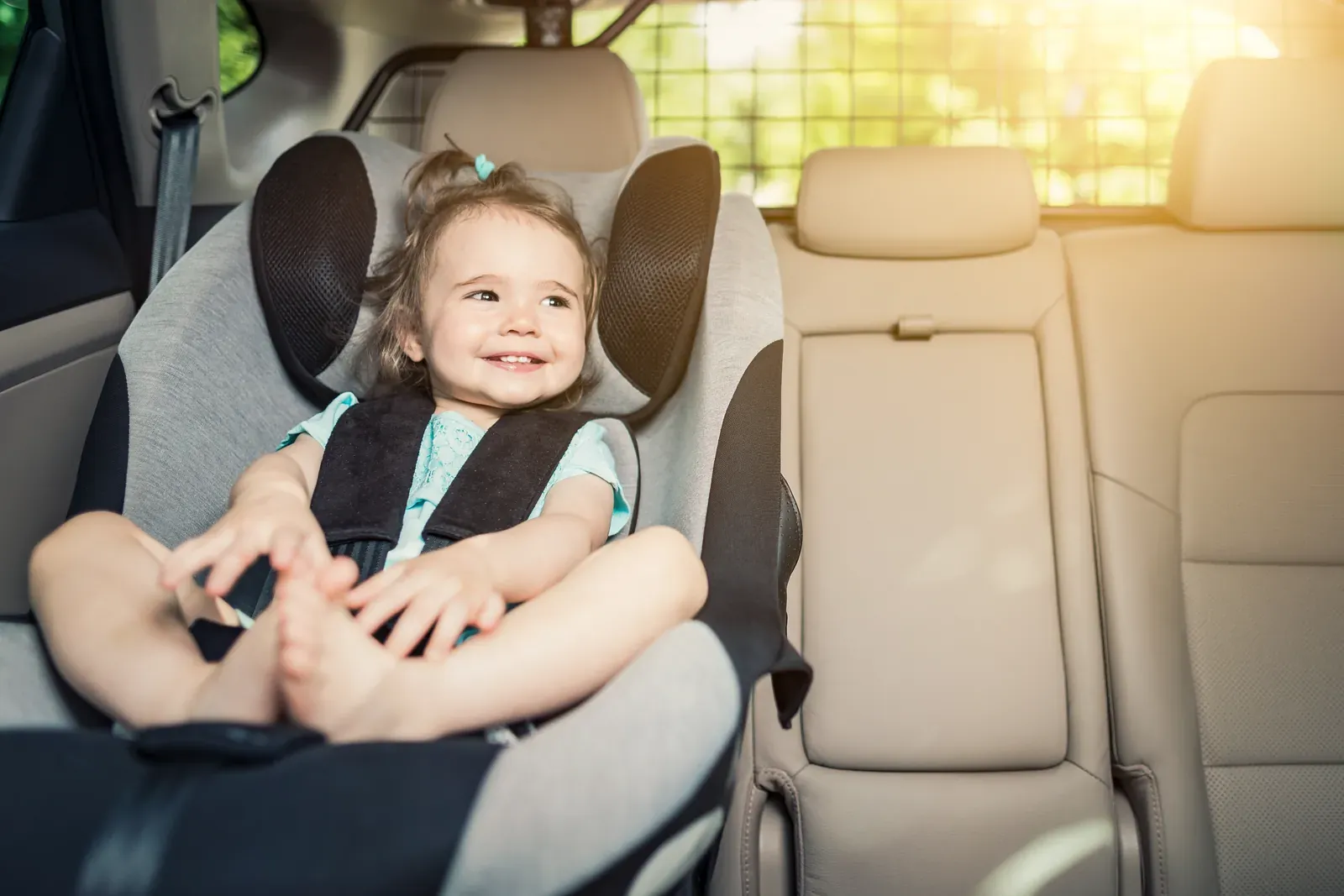 Child car seat installed in the back seat of a car after a crash